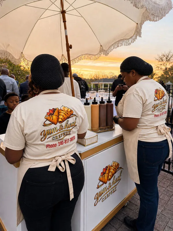 Two Yum&Heal team members serving guests from the dessert cart